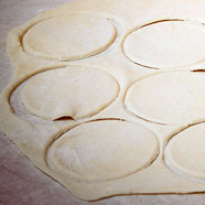 pierogi-dough-cutting-out-circles-photo-by-tastingpoland-com